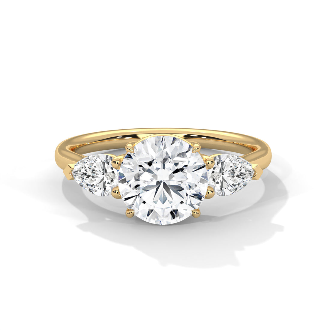Round and Pear Three Stone Ring