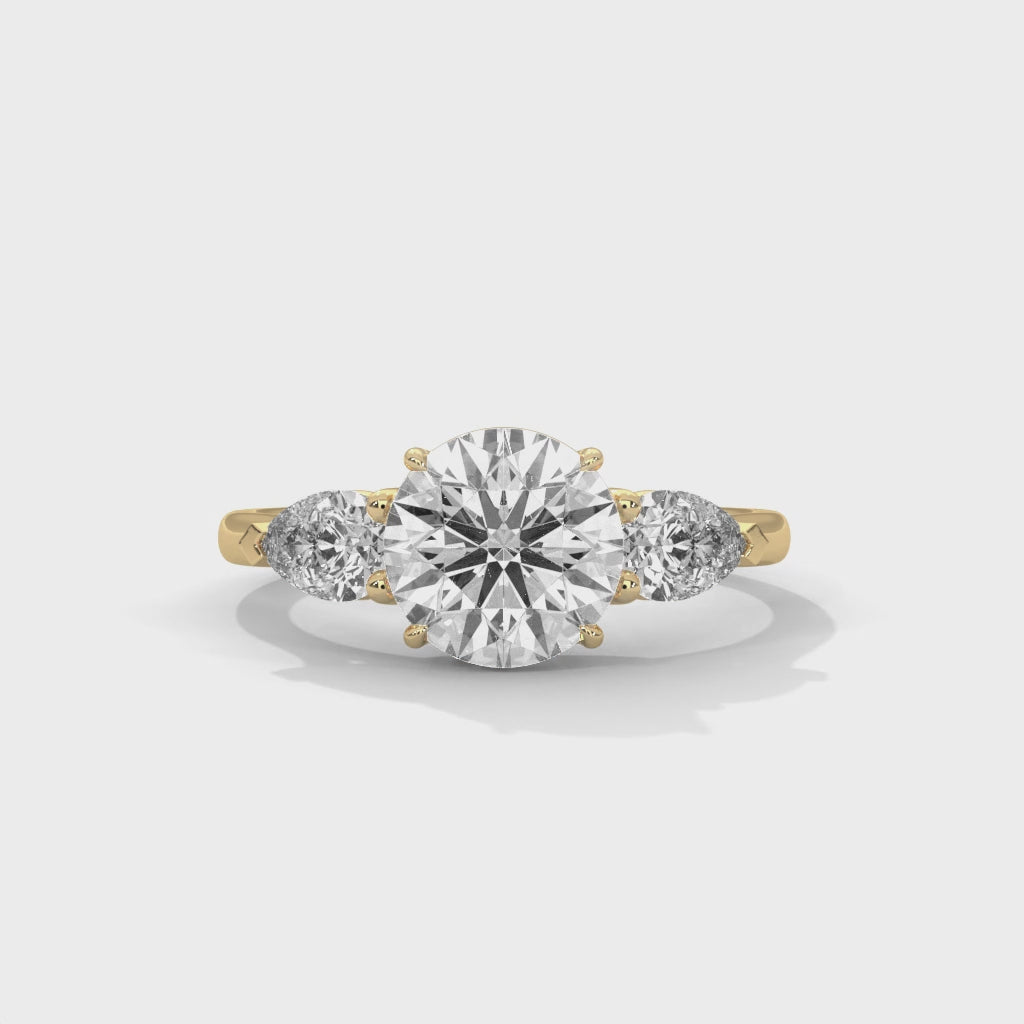Round and Pear Three Stone Ring